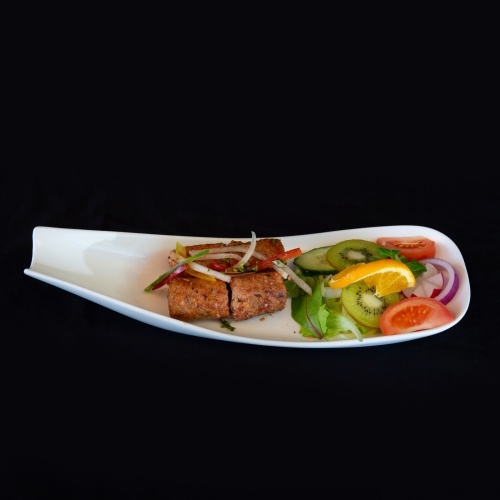 Kebabs served with a side salad