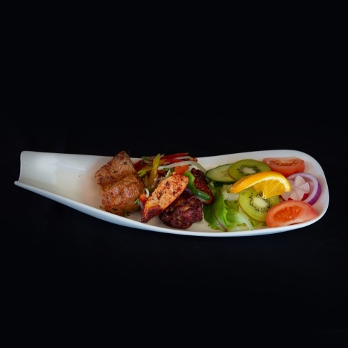 Mixed grill platter with chicken tikka, kebabs